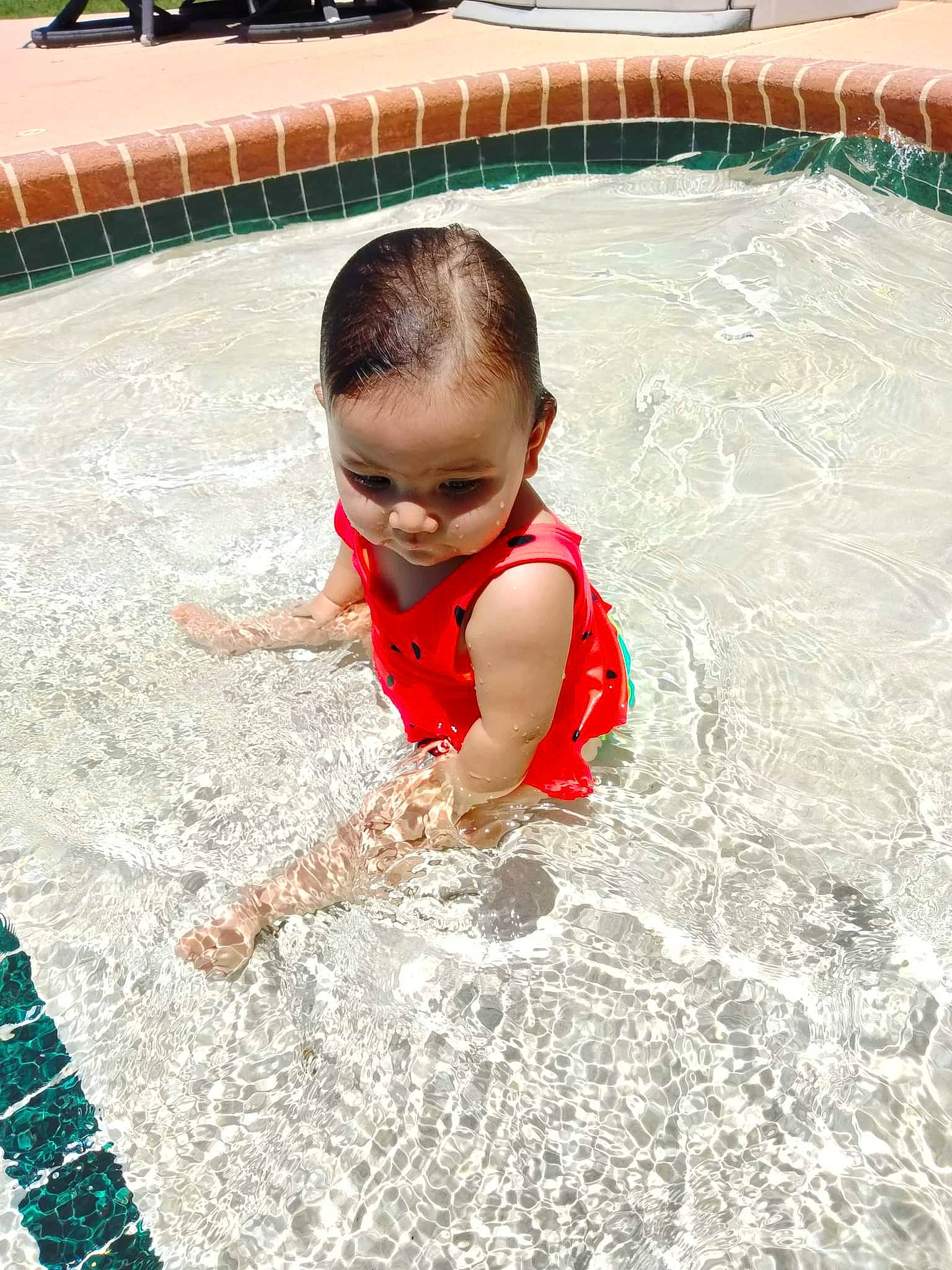 Serenity is registered to the contest to win money with this photo: baby, bathing, child, composite_material, concrete, crawling, flooring, fun, grass, happy, leisure, leisure_centre, nonbuilding_structure, person, play, recreation, soil, swimming_pool, toddler, vacation