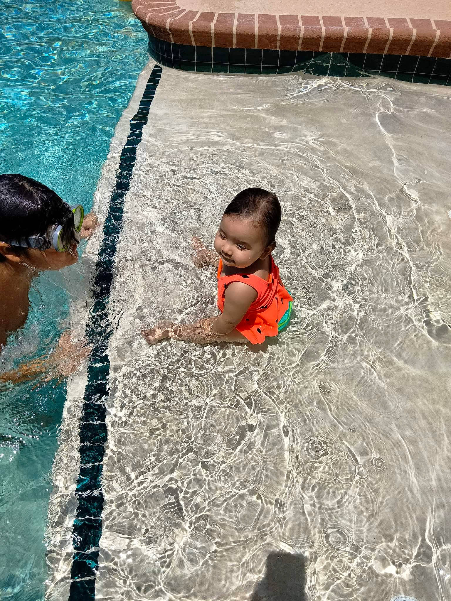 Serenity is registered to the contest to win money with this photo: baby, bathing, child, facial_expression, fun, games, happy, human, human_body, leisure, person, play, product, recreation, swimming_pool, toddler, vacation, water, water_feature, wave