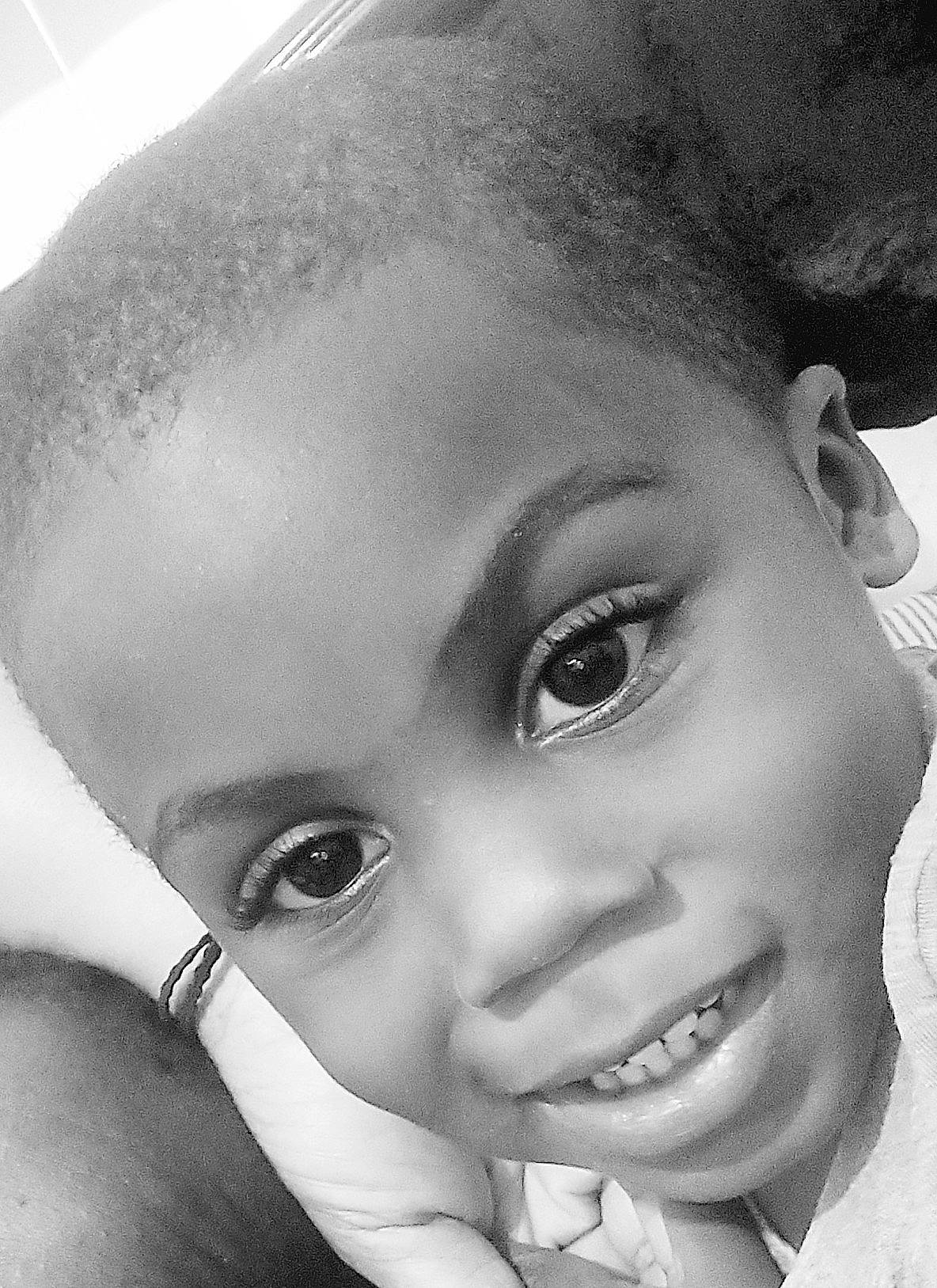 Joel is registered to the contest to win money with this photo: black, black_and_white, cheek, eye, eyebrow, eyelash, face, facial_expression, flash_photography, forehead, happy, iris, jaw, lip, mouth, nose, organ, person, photograph, skin