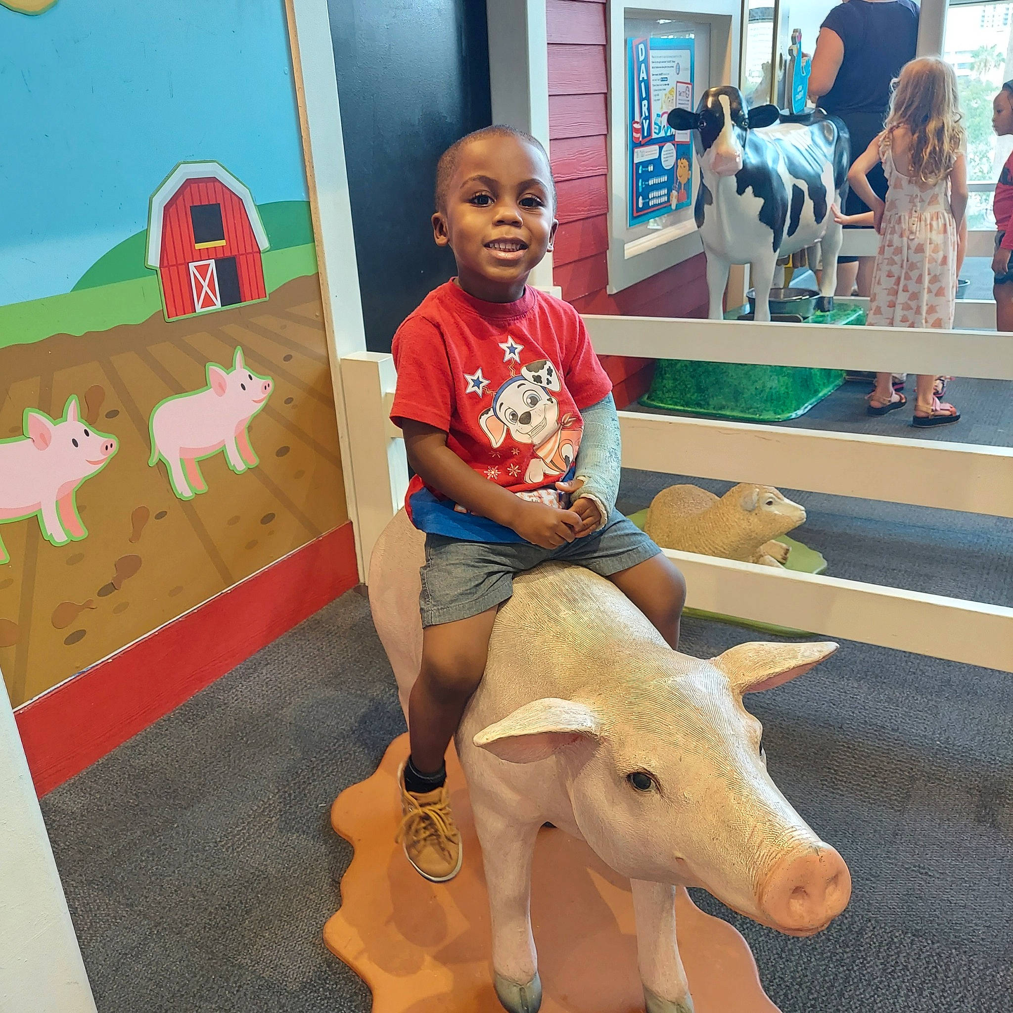 Joel joined the competition — help win amazing prizes! art, child, companion_dog, flooring, fun, happy, human_leg, leisure, person, play, public_space, recreation, room, sitting, smile, stuffed_toy, t_shirt, toddler, toy, visual_arts