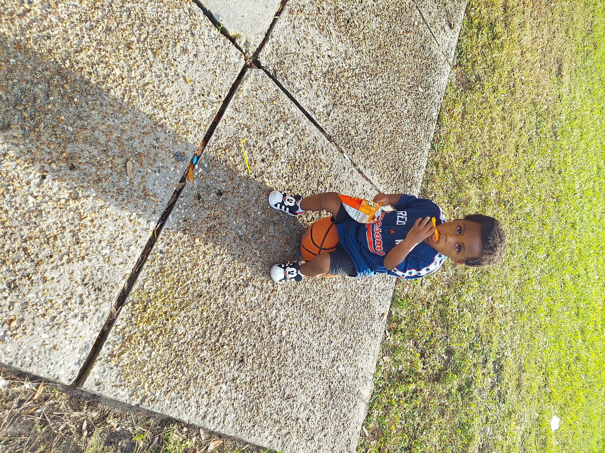 Joel is registered to the contest to win money with this photo: asphalt, city, cobblestone, concrete, electric_blue, flagstone, flooring, grass, grass_family, landscape, leisure, pattern, people_in_nature, person, plant, road_surface, shadow, sidewalk, tints_and_shades, toddler