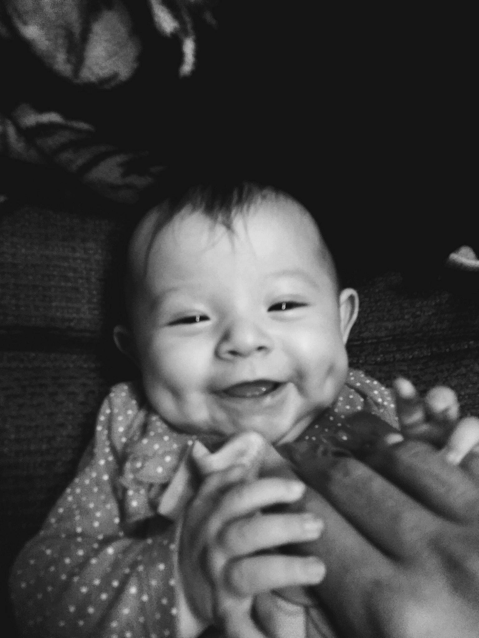 Ainsley is registered to the contest to win money with this photo: baby, black, black_and_white, cheek, chin, eye, eyebrow, flash_photography, gesture, hand, happy, human_body, iris, joy, lip, mouth, nose, person, skin, smile