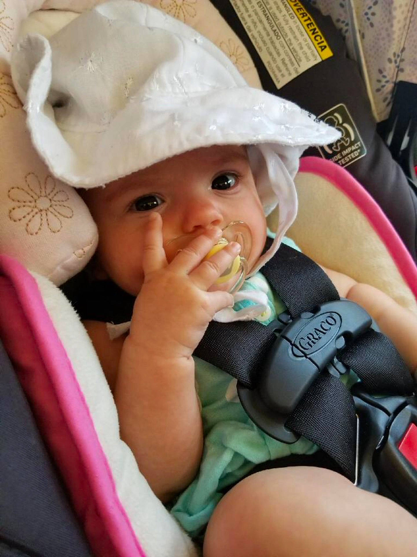 Joslyn is registered to the contest to win money with this photo: arm, baby_products, car_seat, child, day, finger, hand, hat, headgear, headwear, infant, joy, person, product, skin, toddler