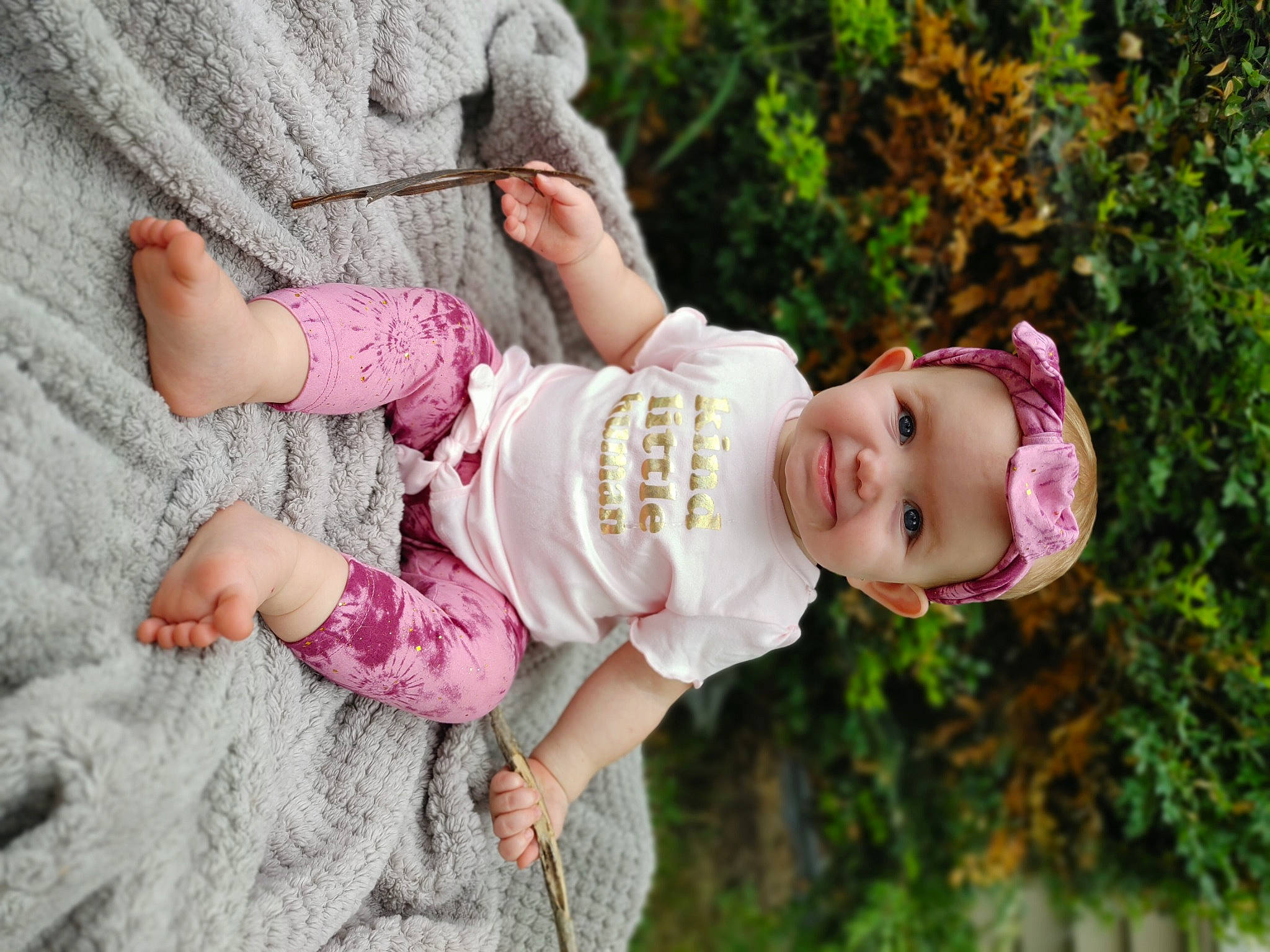 Brynley joined the competition — help win amazing prizes! baby, baby_toddler_clothing, dress, eye, face, gesture, grass, hand, happy, headwear, human_body, joy, leaf, lip, nose, people_in_nature, person, pink, plant, skin