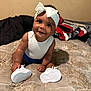 Journee joined the competition — help win amazing prizes! baby, child, smile, white_headband, bow, white_shoes, sitting, mattress, blanket, indoor, happy, cute, infant, clothing, person, portrait, skin, headwear, footwear, young