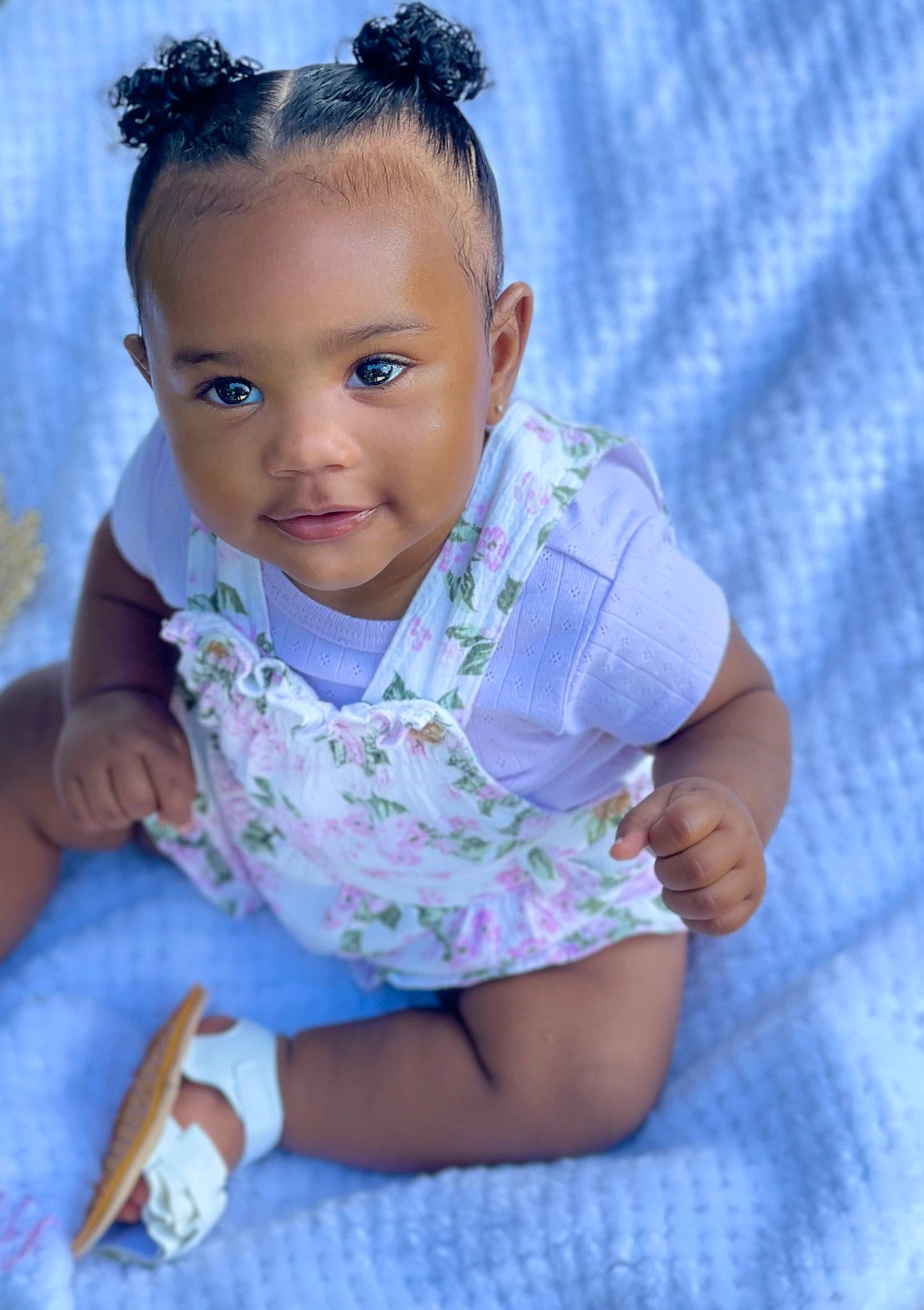 Emani is registered to the contest to win money with this photo: azure, baby, baby_toddler_clothing, blue, cheek, chin, eye, eyelash, hairstyle, hand, happy, head, iris, lip, neck, nose, person, skin, sleeve, t_shirt