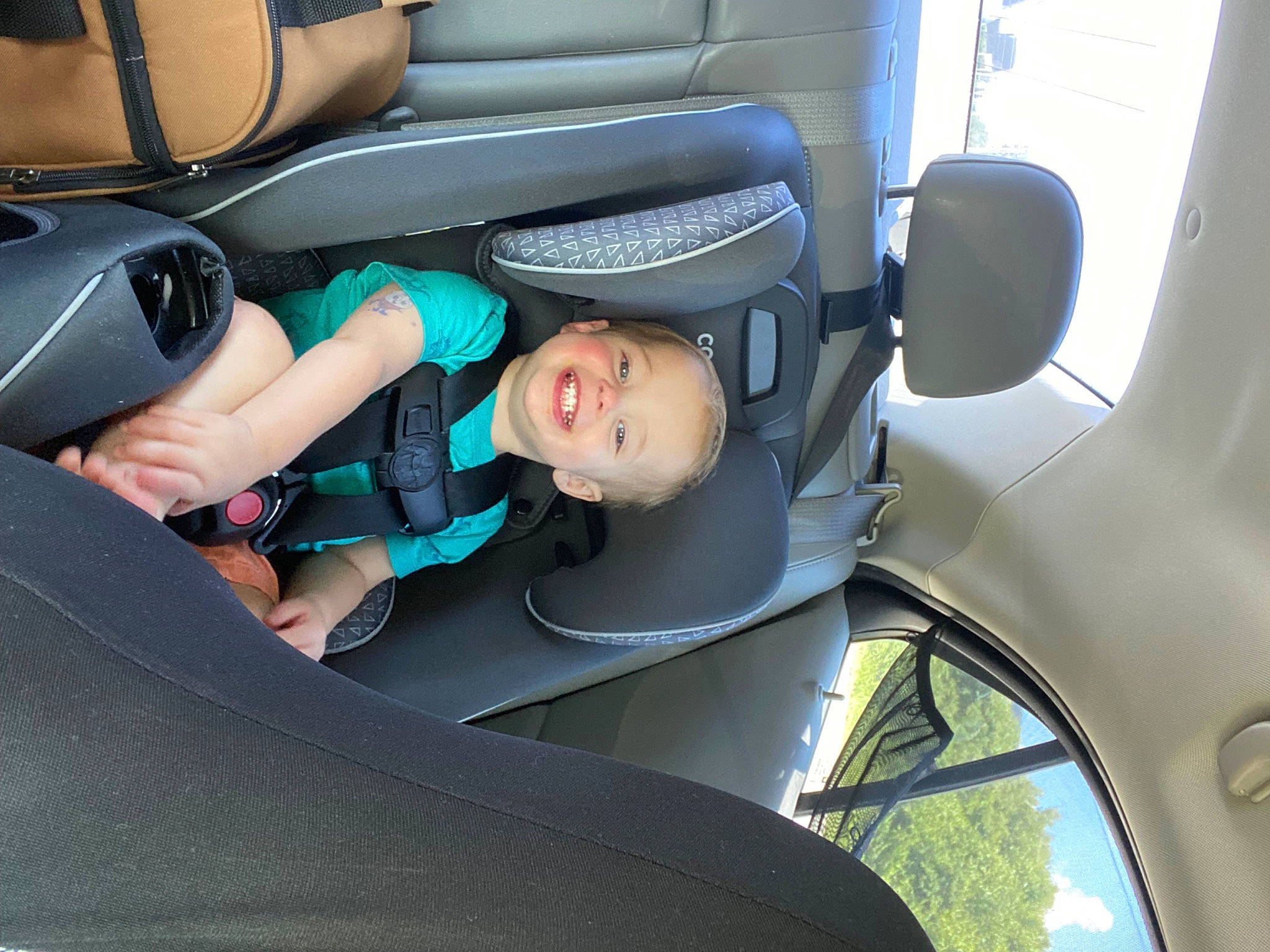 Atticus is registered to the contest to win money with this photo: auto_part, automotive_design, automotive_exterior, automotive_wheel_system, car, car_seat, car_seat_cover, comfort, family_car, head_restraint, joy, motor_vehicle, person, personal_luxury_car, plant, steering_part, steering_wheel, tints_and_shades, toddler, vehicle