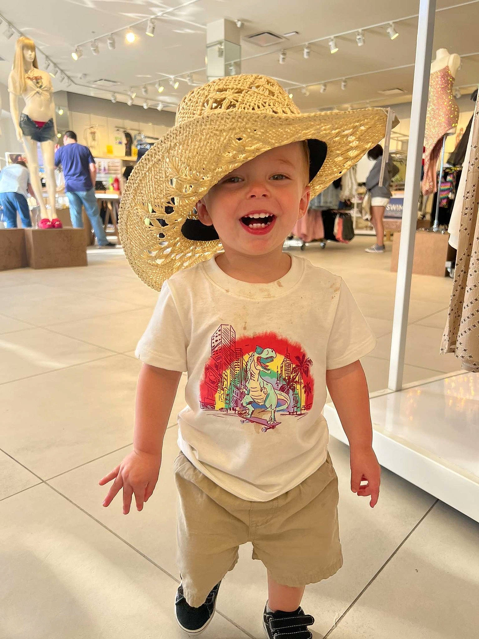 Atticus joined the competition — help win amazing prizes! baby_toddler_clothing, cap, fashion_design, flooring, fun, happy, hat, headgear, headwear, leisure, person, retail, shoe, shopping, skin, sleeve, smile, standing, sun_hat, textile