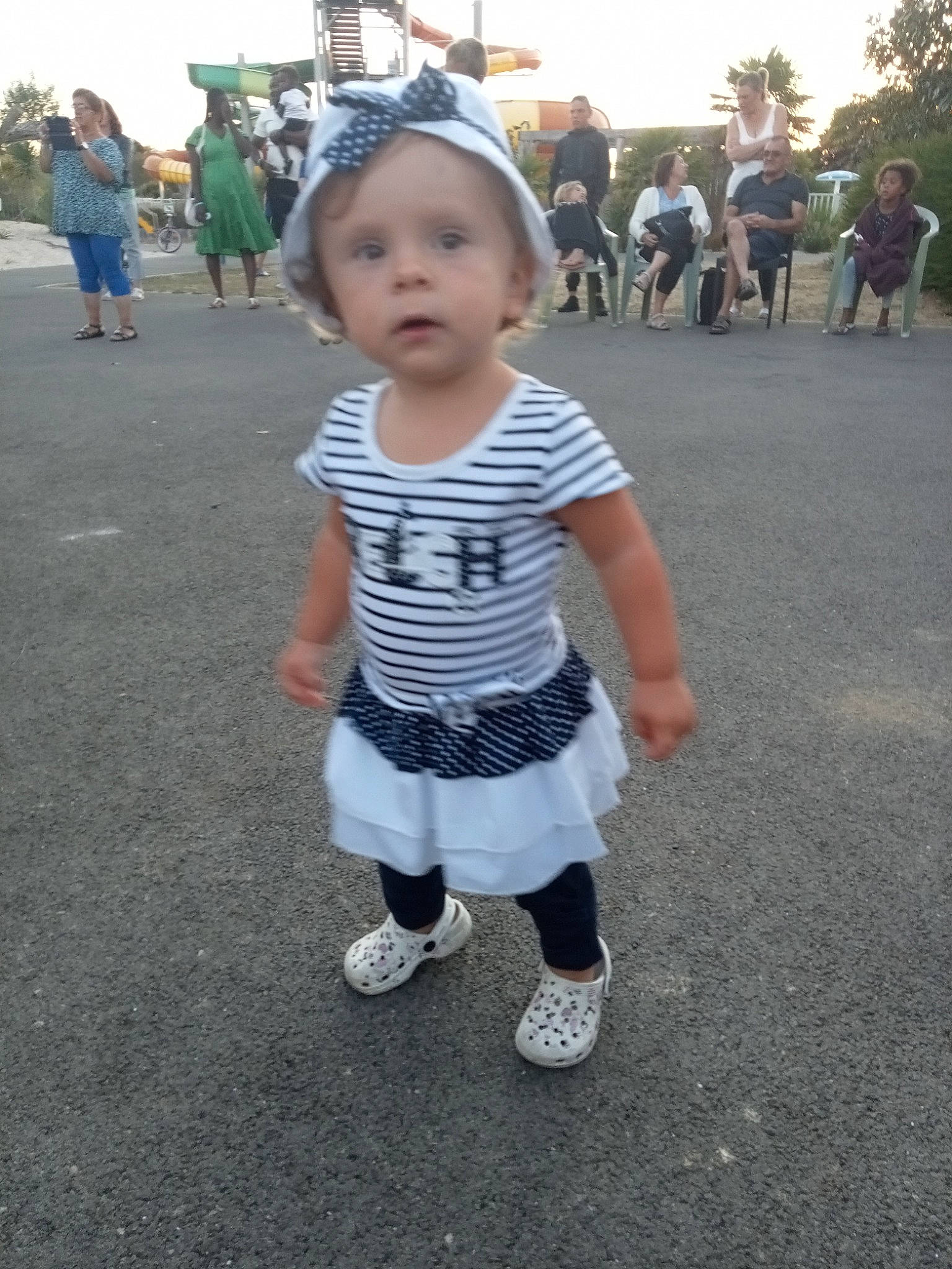 Yéléna participe au concours pour gagner de l'argent avec cette photo : asphalt, baby_toddler_clothing, blurred, child, city, event, fun, happy, leisure, pedestrian, person, recreation, road, road_surface, shorts, sidewalk, sky, sleeve, street, t_shirt