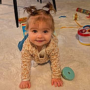 Romy participe au concours pour gagner de l'argent avec cette photo : baby, big_eyes, carpet, child, clothing, crawling, cute, floor, hands, indoors, infant, living_room, pigtails, playtime, portrait, smile, sofa, table, toddler, toy