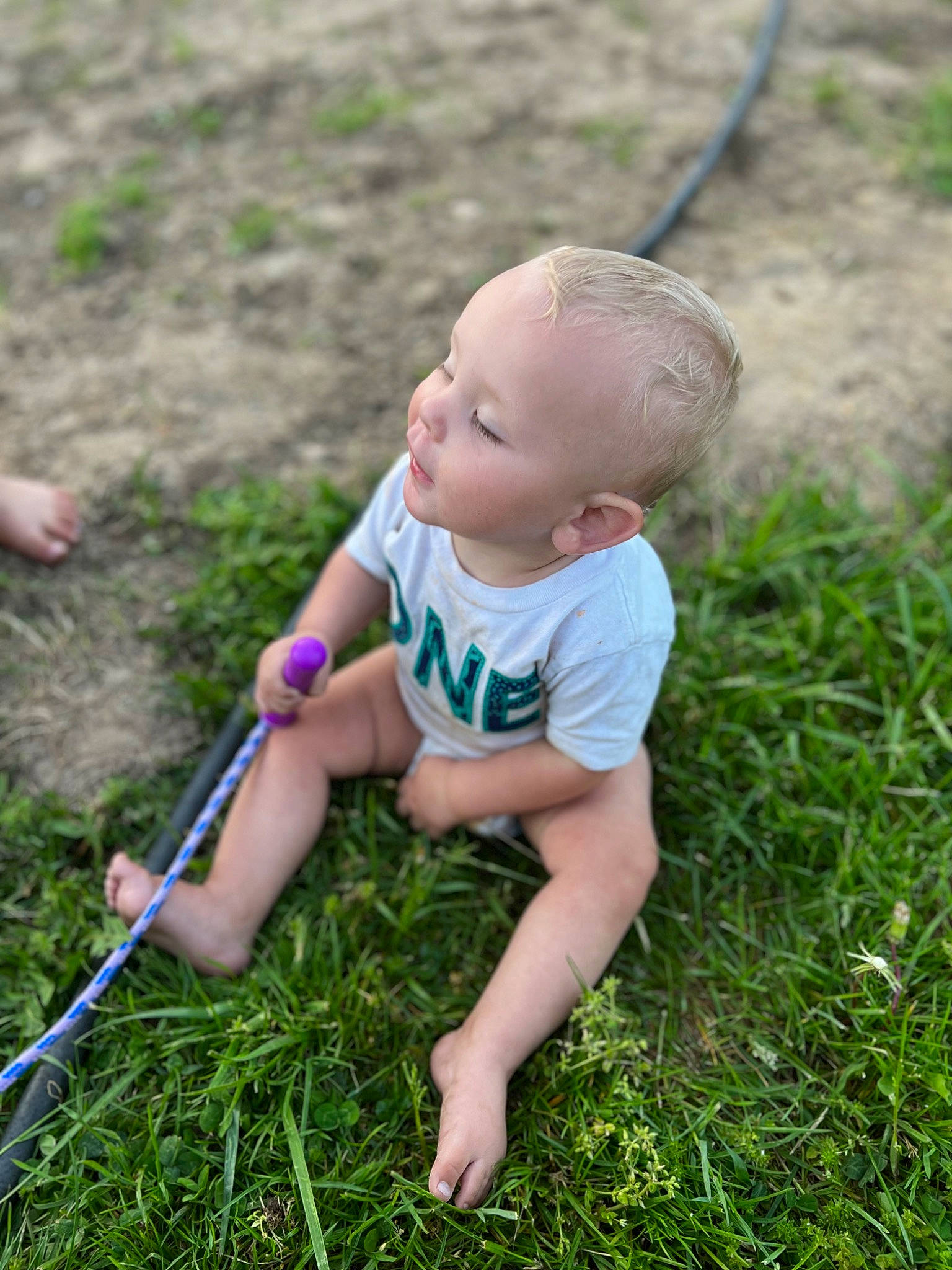 Bryson is registered to the contest to win money with this photo: baby, baby_toddler_clothing, child, fun, grass, grass_family, grassland, happy, lawn, leisure, mammal, meadow, natural_environment, people_in_nature, person, plant, recreation, sitting, smile, toddler