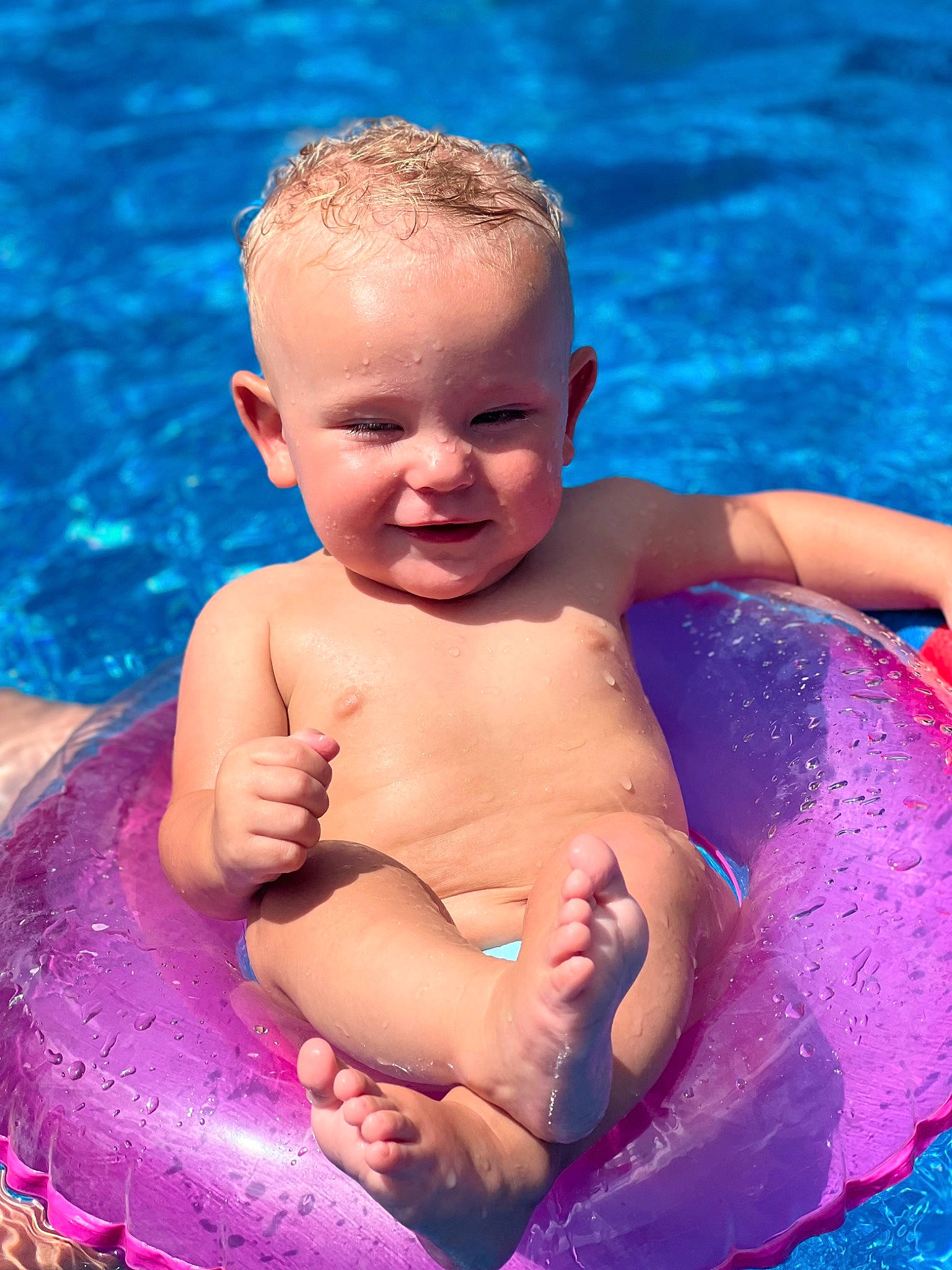 Bryson is registered to the contest to win money with this photo: aqua, azure, baby, bathing, blue, chest, eye, fun, happy, human_body, joy, leisure, muscle, person, red, skin, smile, stomach, swimming_pool, toddler