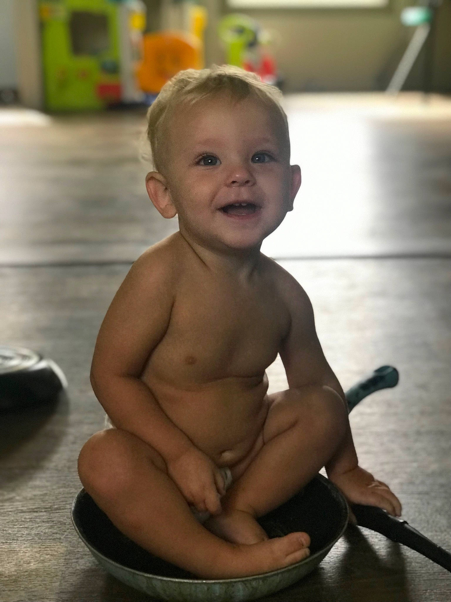 Bryson is registered to the contest to win money with this photo: baby, barechested, cheek, chest, child, elbow, eye, floor, flooring, foot, fun, happy, human_leg, iris, joy, person, skin, smile, thigh, thumb