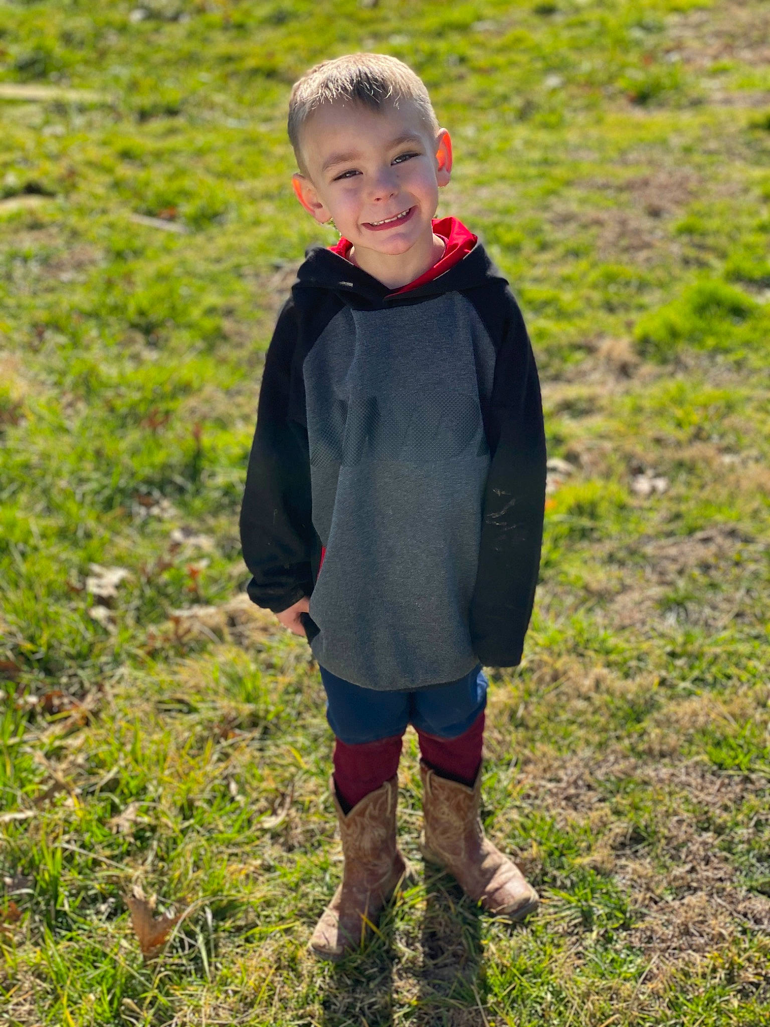 Brenton joined the competition — help win amazing prizes! baby_toddler_clothing, child, face, grass, grass_family, grassland, hair, happy, jacket, joy, meadow, natural_environment, nature, pattern, people_in_nature, person, plant, prairie, sleeve, smile