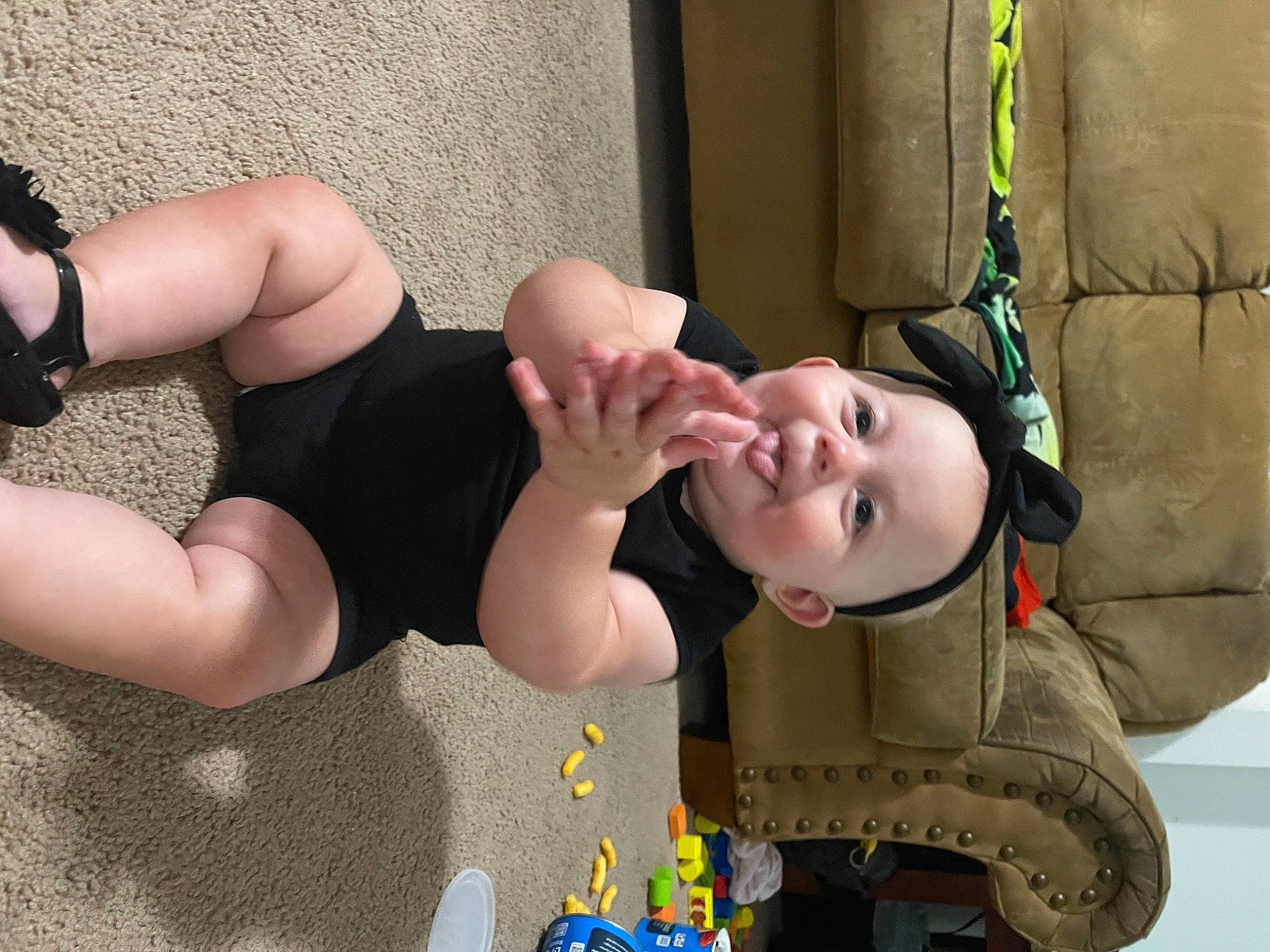 Delilah is registered to the contest to win money with this photo: arm, baby, baby_toddler_clothing, chest, clothing, finger, foot, fun, gesture, hairstyle, happy, headwear, human_body, joint, knee, leg, mouth, neck, person, smile