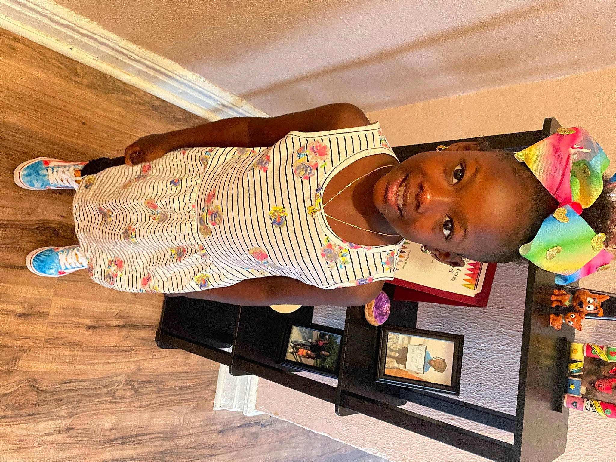 Apryl is registered to the contest to win money with this photo: art, child, eyewear, flooring, happy, hardwood, hat, human_leg, joy, magenta, pattern, person, room, smile, thigh, varnish, visual_arts, wood, wood_flooring, wood_stain