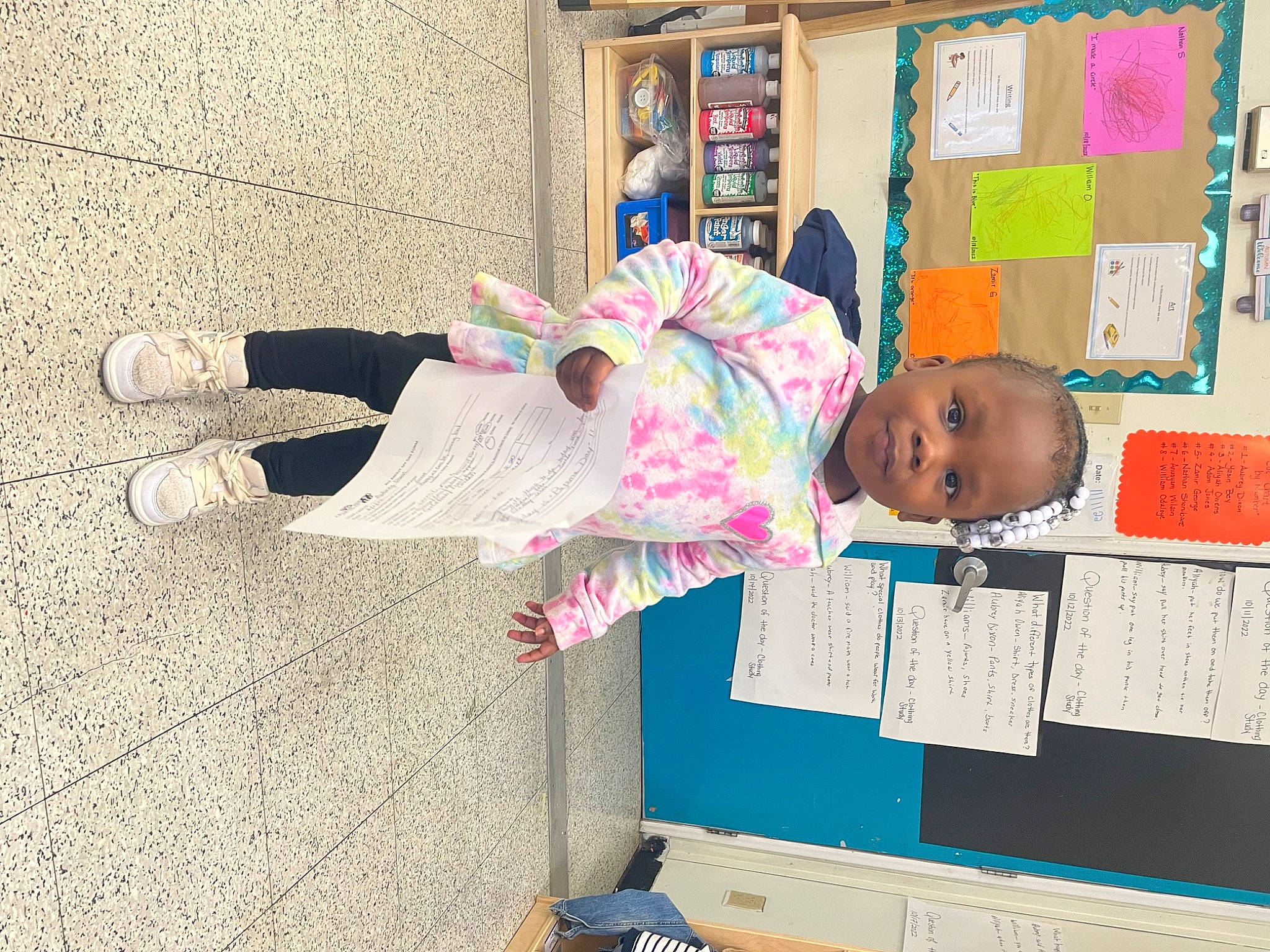 Aubrey is registered to the contest to win money with this photo: baby, baby_toddler_clothing, building, child, flooring, fun, house, kindergarten, leisure, magenta, person, play, room, school, shelf, shelving, toddler, visual_arts