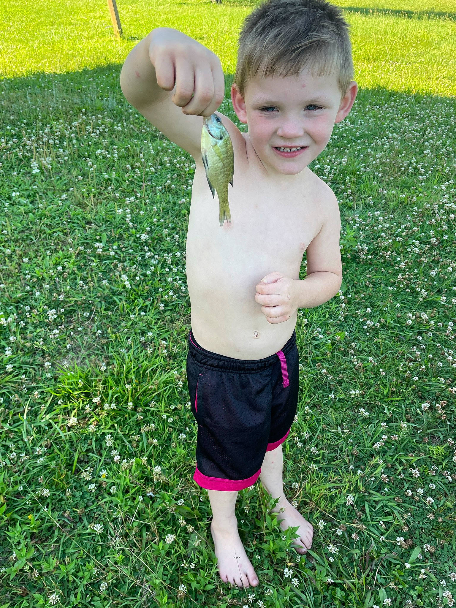 Julian joined the competition — help win amazing prizes! baby_toddler_clothing, barefoot, child, fun, gesture, grass, grass_family, grassland, green, groundcover, happy, joy, lawn, meadow, people_in_nature, person, plant, smile, summer, t_shirt