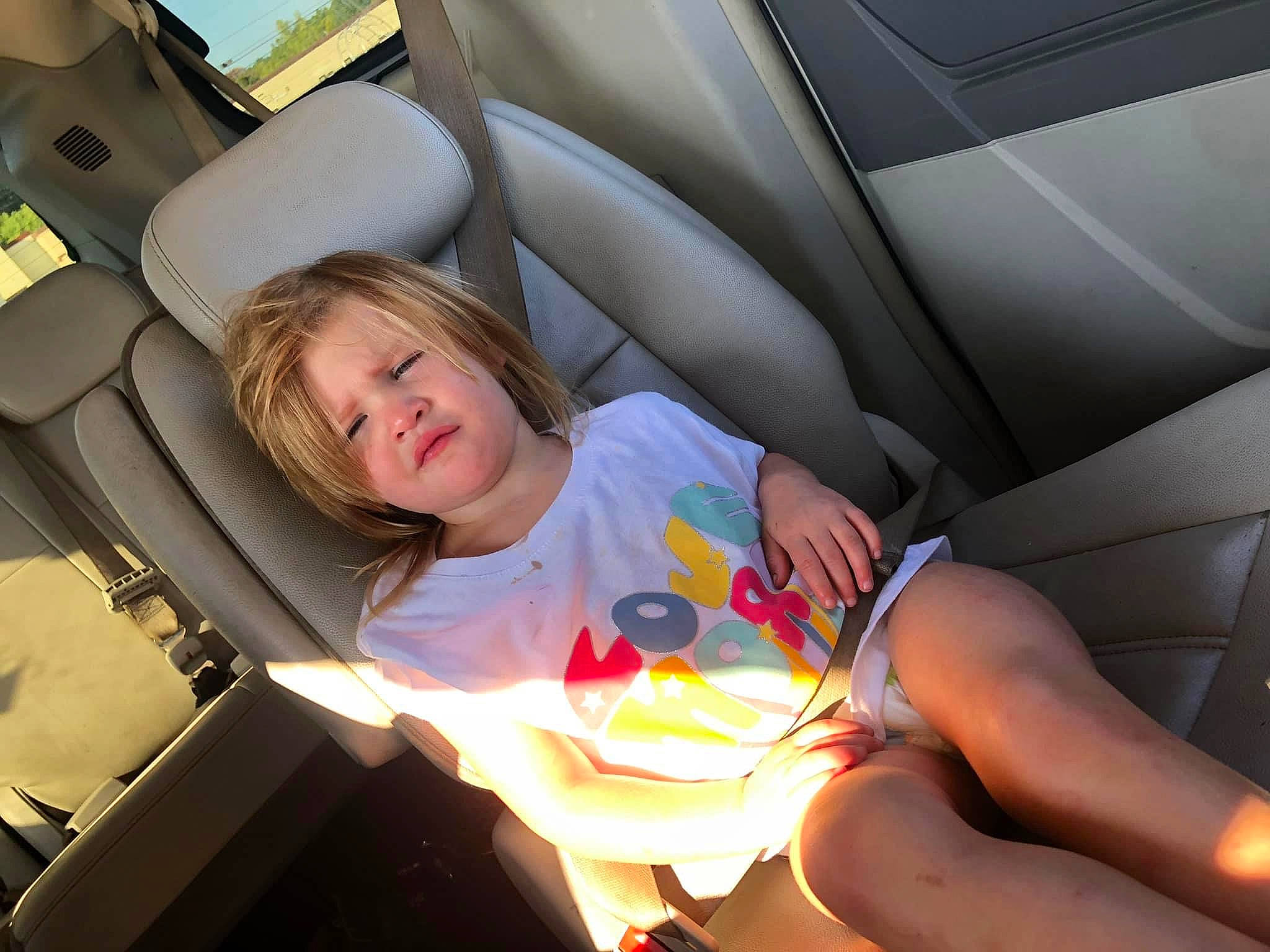 Jayde is registered to the contest to win money with this photo: auto_part, automotive_design, automotive_exterior, car_seat, car_seat_cover, comfort, elbow, family_car, fun, head_restraint, human_leg, knee, leg, leisure, motor_vehicle, person, personal_luxury_car, sorrow, thigh, toddler