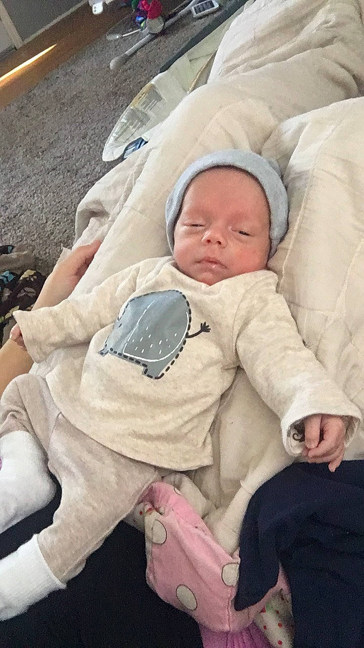 Justice is registered to the contest to win money with this photo: baby, baby_products, baby_safety, baby_sleeping, baby_toddler_clothing, bedtime, cheek, child, comfort, linens, nap, person, sitting, sleep, toddler, winter