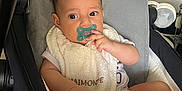 Lyvaï a rejoint le concours — aidez-le/la à gagner de superbes lots ! baby, pacifier, stroller, bib, indoor, child, cute, infant, seat, cushion, clothing, person, young, hand, face, relaxing, comfort, light, expression, portrait