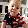 Isaiah is registered to the contest to win money with this photo: baby, infant, crawling, bed, blanket, pajamas, stars, stripes, red, white, blue, cute, indoors, child, person, face, smiling, hands, feet, soft