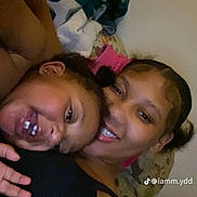 Meilanilee is registered to the contest to win money with this photo: child, woman, smiling, laughing, couch, blanket, indoors, happy, face, head, people, casual, cozy, family, portrait, tiktok, watermark, young, skin, hair