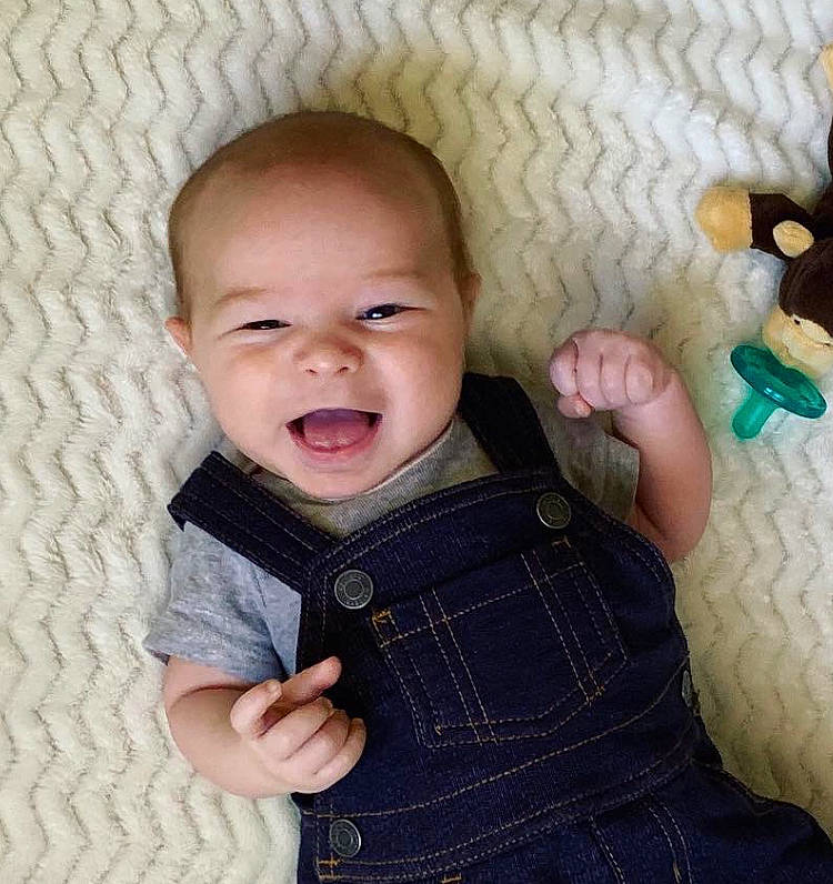 Roland is registered to the contest to win money with this photo: baby, cheek, child, face, facial_expression, finger, head, knitting, nose, person, skin, smile, toddler, wool