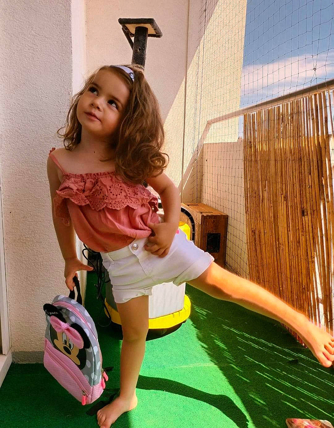 Sharon participe au concours pour gagner de l'argent avec cette photo : bag, child, fun, grass, happy, human_leg, knee, leg, leisure, luggage_and_bags, magenta, people_in_nature, person, pink, play, recreation, shorts, sitting, smile, thigh