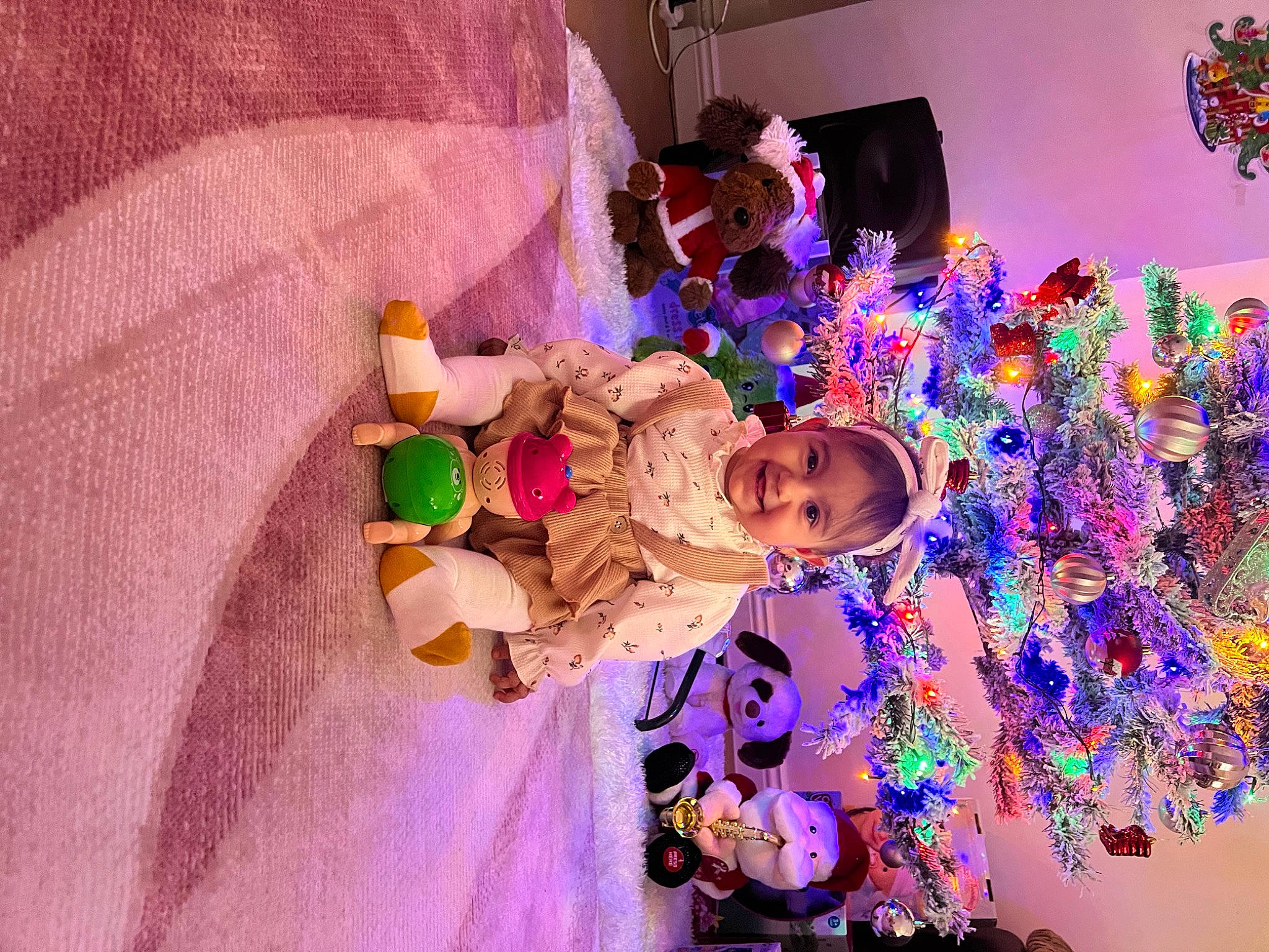 Patricia Nicoleta is registered to the contest to win money with this photo: baby, child, christmas_decoration, christmas_ornament, event, fun, holiday, joy, magenta, organism, ornament, party, person, pink, plant, purple, room, textile, toddler, toy