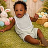 baby, child, grass, easter_eggs, plush_bunny, basket, flowers, garland, pastel_colors, spring, smiling, cute, outdoor, festive, holiday, greenery, infant, bib, shorts, shoes