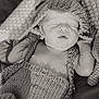Deklan is registered to the contest to win money with this photo: baby, newborn, sleeping, knitted_clothing, hat, blanket, monochrome, portrait, infant, peaceful, soft_texture, closeup, cute, resting, child, cozy, indoors, wrapped, small_hands, relaxing