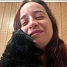 Raven joined the competition — help win amazing prizes! affection, animal, black_cat, cat, ceiling, close_up, companion, cute, domestic_animal, face, fur, happy, indoor, long_hair, love, nuzzle, person, pet, smiling, wood_panel_wall
