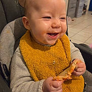 Azelie participe au concours pour gagner de l'argent avec cette photo : baby, infant, highchair, bib, food, eating, messy, smile, happy, hands, meal, indoor, kitchen, tile_floor, clothing, seat, closeup, face, teeth, cheese