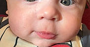 Itai joined the competition — help win amazing prizes! baby, infant, face, close_up, child, cute, eyes, expression, portrait, clothing, number, striped, red, skin, head, person, young, adorable, baby_outfit, indoors