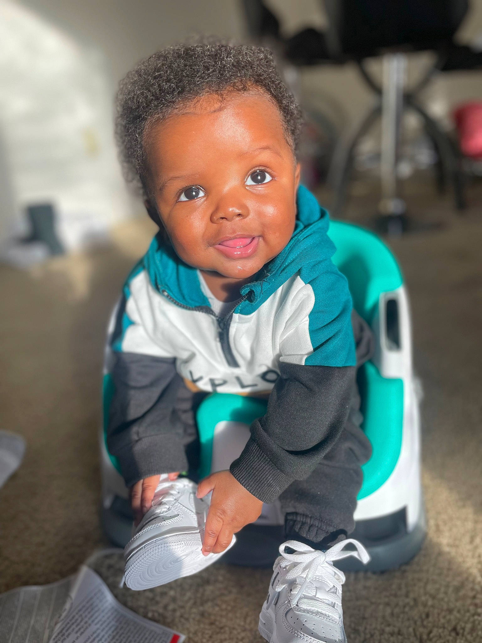 Zaiden joined the competition — help win amazing prizes! automotive_wheel_system, baby, baby_products, chair, child, electric_blue, eye, flash_photography, fun, happy, hoodie, leisure, person, portrait_photography, sitting, smile, sneakers, soil, toddler, vacation