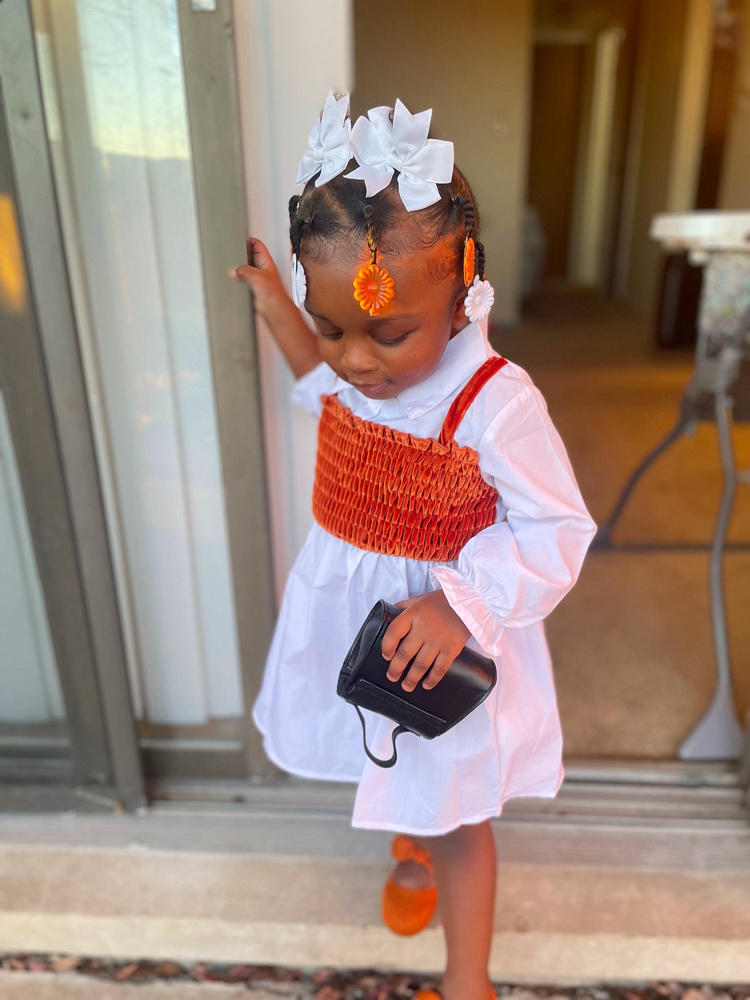 Brielle is registered to the contest to win money with this photo: baby_toddler_clothing, bag, child, costume, door, eyewear, fashion_accessory, fun, happy, hat, human_leg, luggage_and_bags, orange, pattern, peach, person, sleeve, sunglasses, thigh, toddler