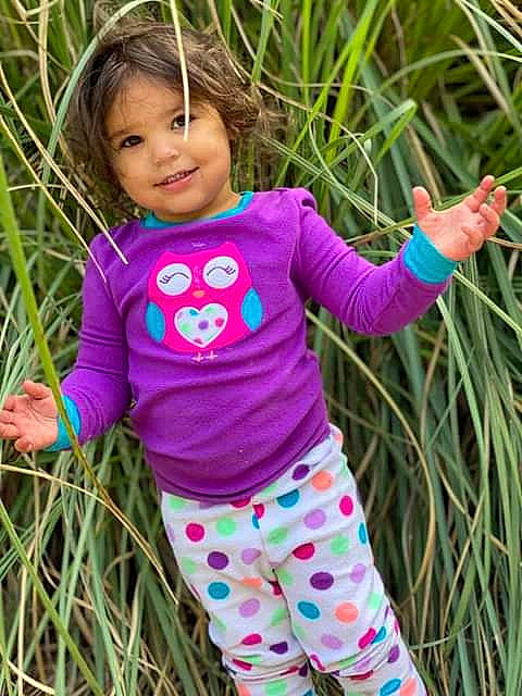 Nelli joined the competition — help win amazing prizes! arm, baby_toddler_clothing, face, fun, grass, green, happy, joy, outerwear, people_in_nature, person, pink, plant, product, purple, shirt, sleeve, smile, standing, terrestrial_plant