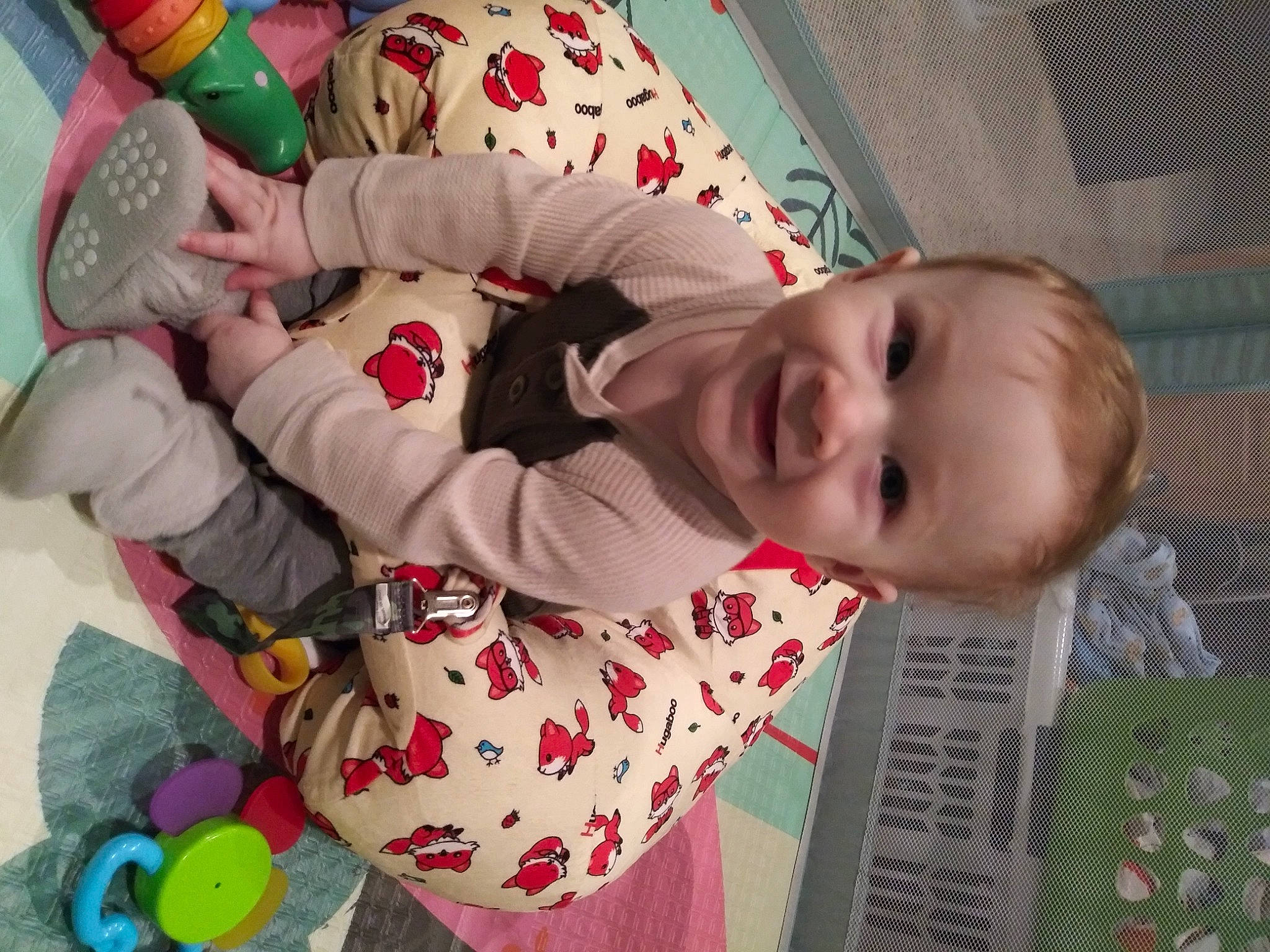 Damian is registered to the contest to win money with this photo: baby, baby_toddler_clothing, beauty, carmine, child, event, facial_expression, fun, happy, holiday, joy, pajamas, pattern, person, play, room, skin, sleeve, smile, toddler