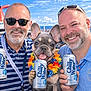dog, french_bulldog, men, smiling, sunglasses, beard, cruise_ship, ocean, drink_can, chilly_water, lei, vacation, deck, friends, portrait, close_up, summer, cheerful, crowd, sunny