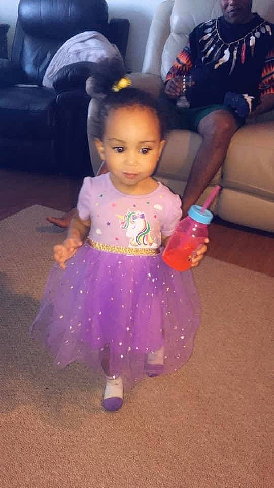 Ximena joined the competition — help win amazing prizes! baby_toddler_clothing, child, couch, dress, event, floor, flooring, formal_wear, fun, hairstyle, happy, magenta, organ, person, pink, purple, skin, textile, toddler, toy