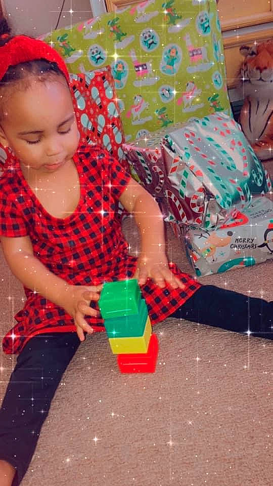 Ximena joined the competition — help win amazing prizes! adaptation, baby_playing_with_toys, baby_toddler_clothing, child, design, fun, happy, leisure, linens, magenta, party, pattern, person, pink, plaid, plastic, play, sitting, textile, toddler