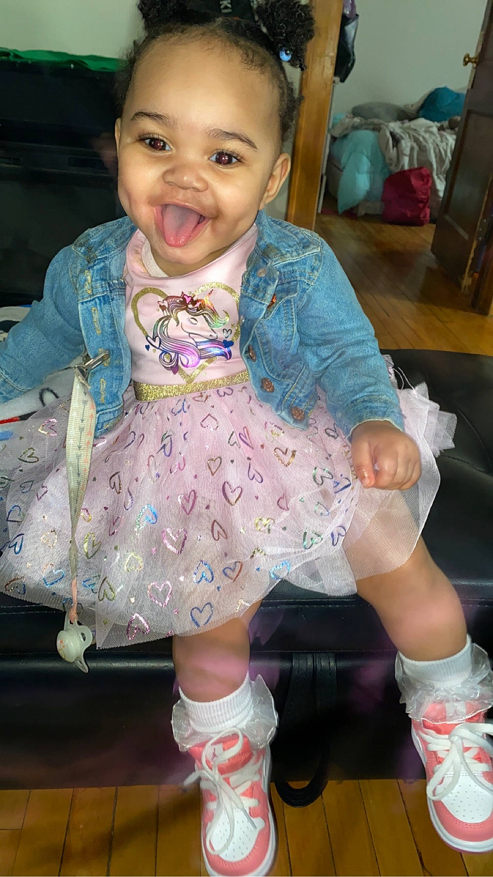 Zatyra is registered to the contest to win money with this photo: baby, baby_toddler_clothing, cheek, child, embellishment, face, fashion_accessory, fun, happy, human_leg, joy, pattern, person, pink, purple, sitting, skin, sleeve, smile, sock