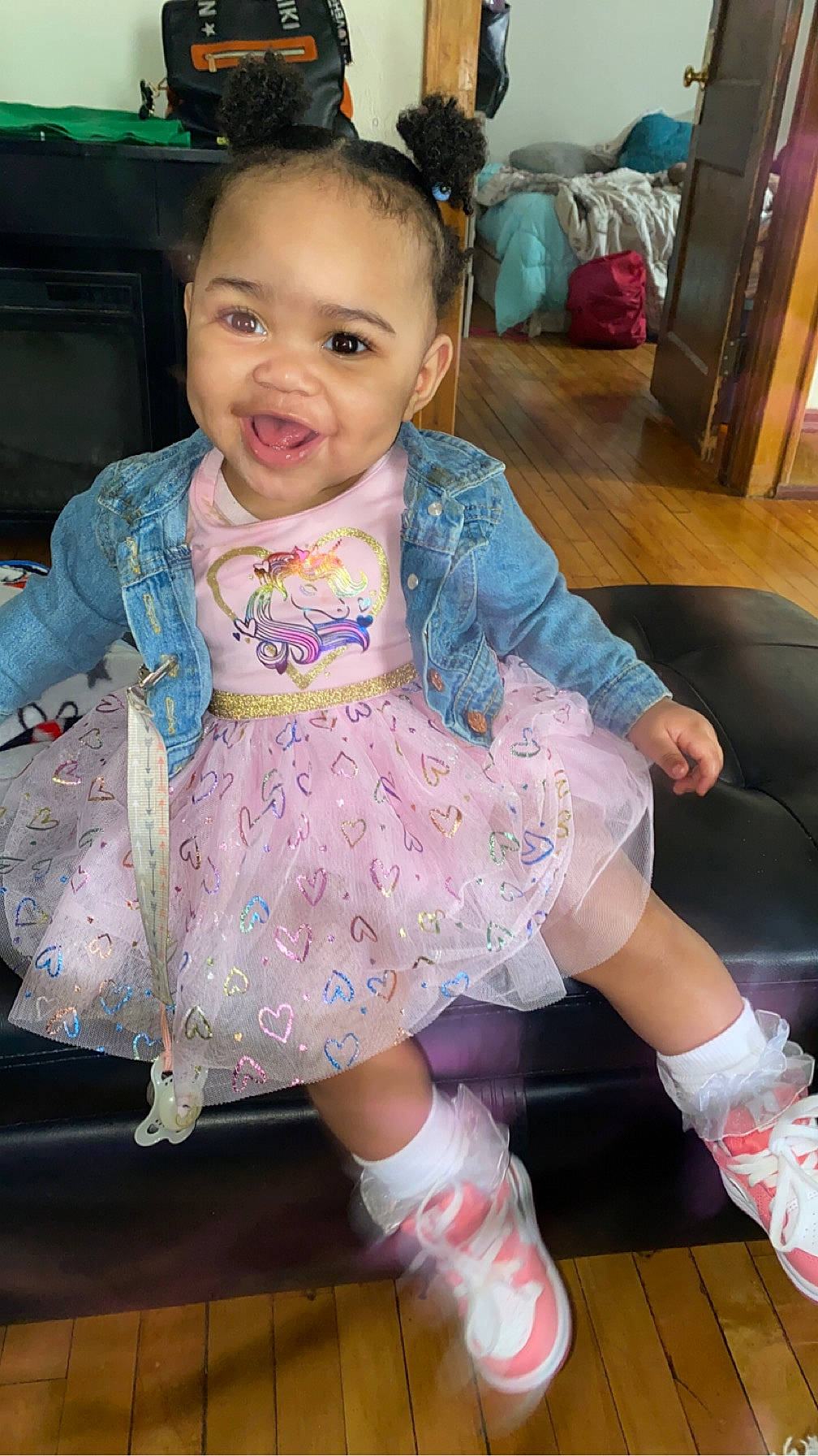 Zatyra is registered to the contest to win money with this photo: baby, baby_toddler_clothing, cheek, child, dress, fashion_accessory, fun, happy, head, iris, magenta, pattern, person, pink, purple, sitting, skin, sleeve, smile, sock