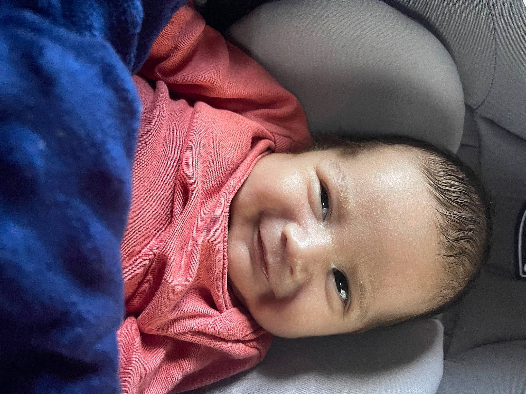 Carlos is registered to the contest to win money with this photo: auto_part, baby, baby_products, baby_toddler_clothing, car_seat, cheek, child, comfort, eyelash, flash_photography, happy, joy, lip, nose, person, portrait_photography, sitting, skin, smile, toddler