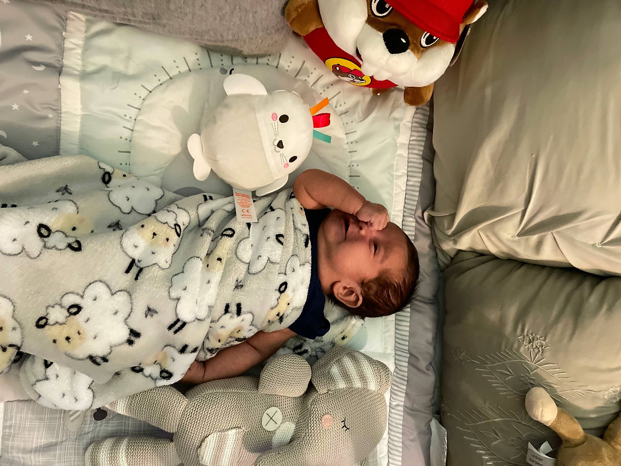 Carlos is registered to the contest to win money with this photo: baby, baby_safety, baby_sleeping, baby_toddler_clothing, bed, bed_sheet, bedding, bedtime, carmine, child, comfort, fun, happy, linens, pattern, person, room, stuffed_toy, textile, toddler