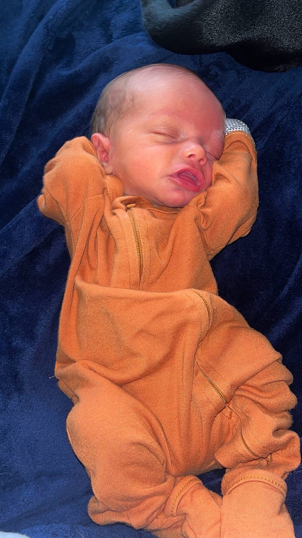 Cooper joined the competition — help win amazing prizes! baby, baby_sleeping, baby_toddler_clothing, cheek, child, chin, comfort, electric_blue, finger, flooring, linens, mouth, neck, nose, orange, person, sitting, skin, sleeve, textile