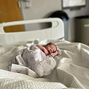 Kizer joined the competition — help win amazing prizes! newborn, baby, hospital_bed, blanket, swaddled, sleeping, infant, white, bedspread, soft_focus, hospital_room, peaceful, resting, person, healthcare, tiny, wrapped, indoor, quiet, calm
