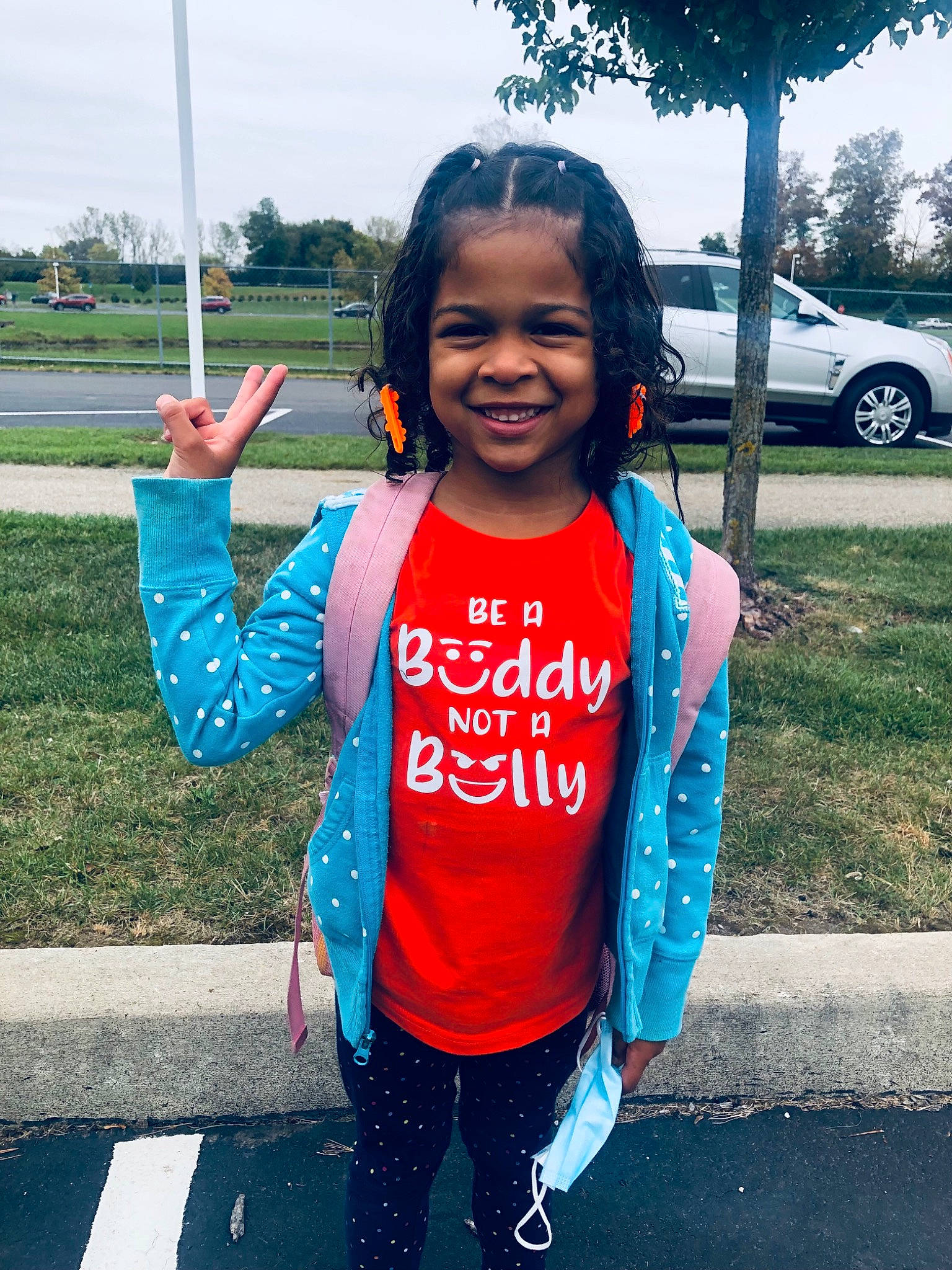 Kameerah is registered to the contest to win money with this photo: asphalt, cool, electric_blue, finger, fun, gesture, happy, joy, leisure, person, public_space, recreation, road, sky, sleeve, smile, summer, t_shirt, tire, travel