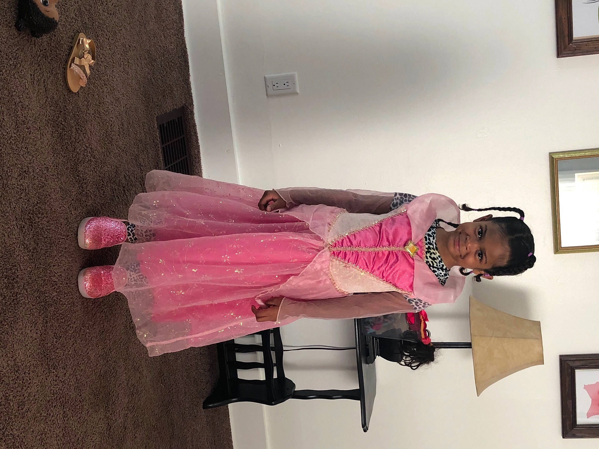 Kameerah is registered to the contest to win money with this photo: cleanliness, cocktail_dress, comfort, fashion_design, flooring, hardwood, joy, magenta, pattern, person, picture_frame, pink, plaster, room, sleeve, smile, waist, wood, wrist